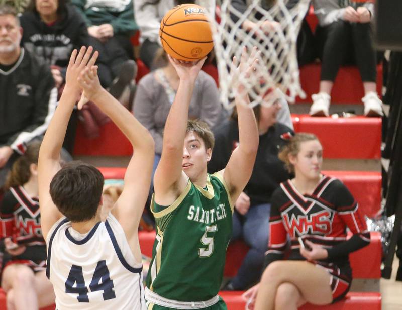 St. Bede's Halden Hueneburg shoots a jump shot over Ridgeview's Landon Ludwig during the Route 17 Classic Tournament on Wednesday, Nov. 27, 2024 at Woodland High School.