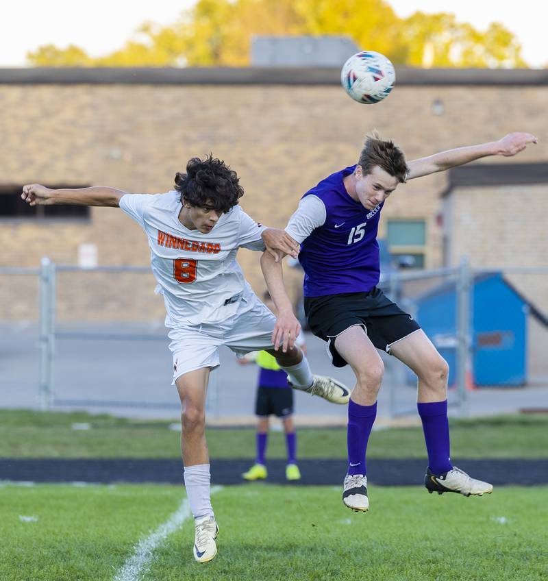 Winnebago’s Drew Intravaia and Dixon’s Logan Grett work for the ball Thursday, Sept. 26, 2024, at Dixon High School.