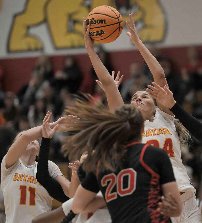Batavia’s Hallie Crane gets a rebound agianst Maine South in a girls basketball game in Batavia on Tuesday, Jan. 14, 2025.