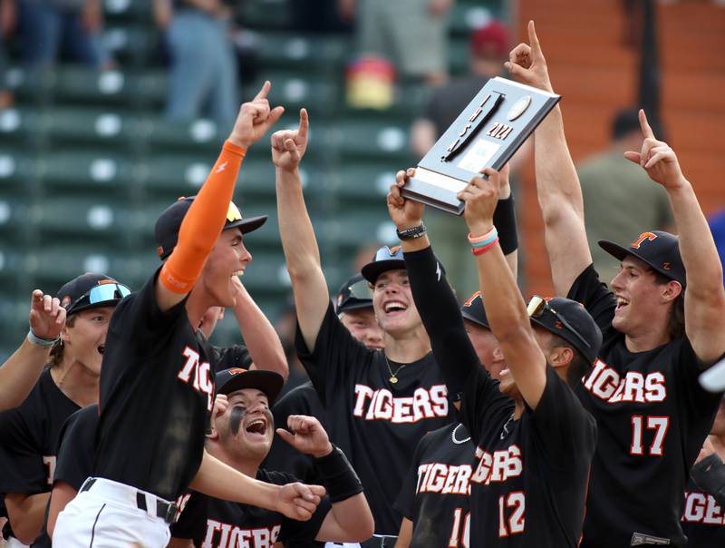 Crystal Lake Central players celebrate a win in supersectional baseball action against DePaul College Prep at Wintrust Field in Schaumburg Monday.