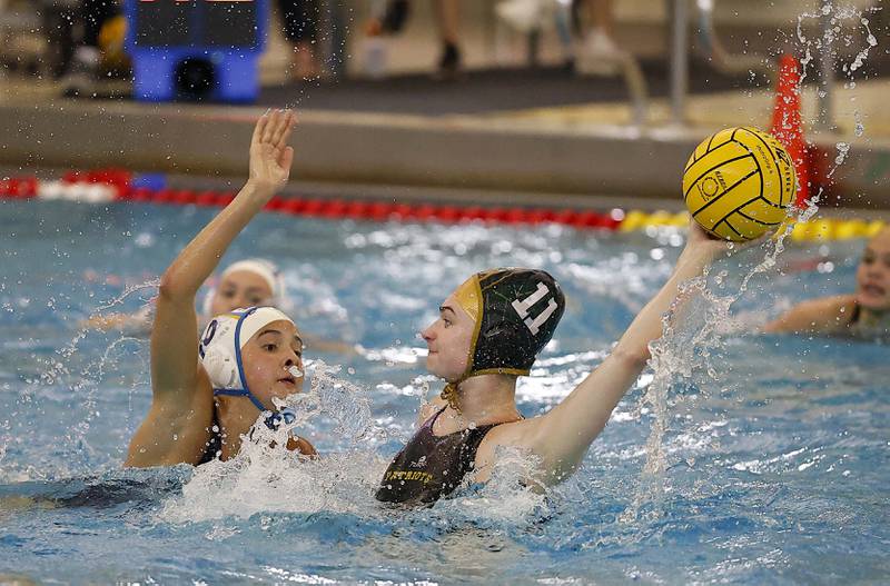 Lyons Township's Avery Watanabe (10) tries to defend against Stevenson's Caroline Bichkoff (11) during the IHSA State Finals of the Girls Water Polo Saturday, May 24, 2025 at Stevenson High School in Lincolnshire.