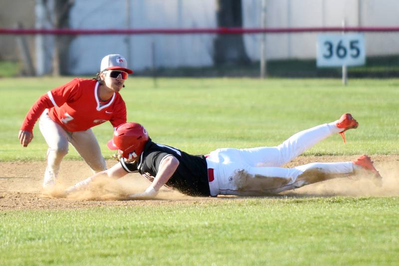 Bradley-Bourbonnais' Ellis Johnson, right, dives around a tag from Homewood-Flossmoor's Mateo Morales to steal second base during a game at Bradley-Bourbonnais Friday, April 11, 2025.