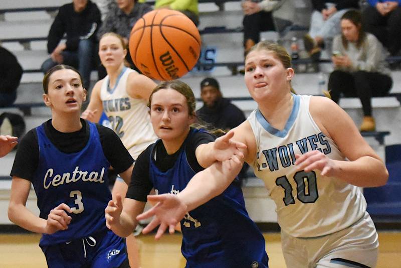 From left, Clifton Central's Emma Koch and Alexis Prisock and Cissna Park's Ava Henrichs chase down a rebound during a game at Cissna Park Wednesday, Feb. 4, 2026.
