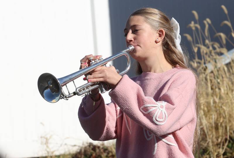 Logan Jr. High student Elizabeth Keutzer plays Taps during the Veterans Day program on Friday, Nov. 7, 2025 at Logan Jr. High in Princeton .