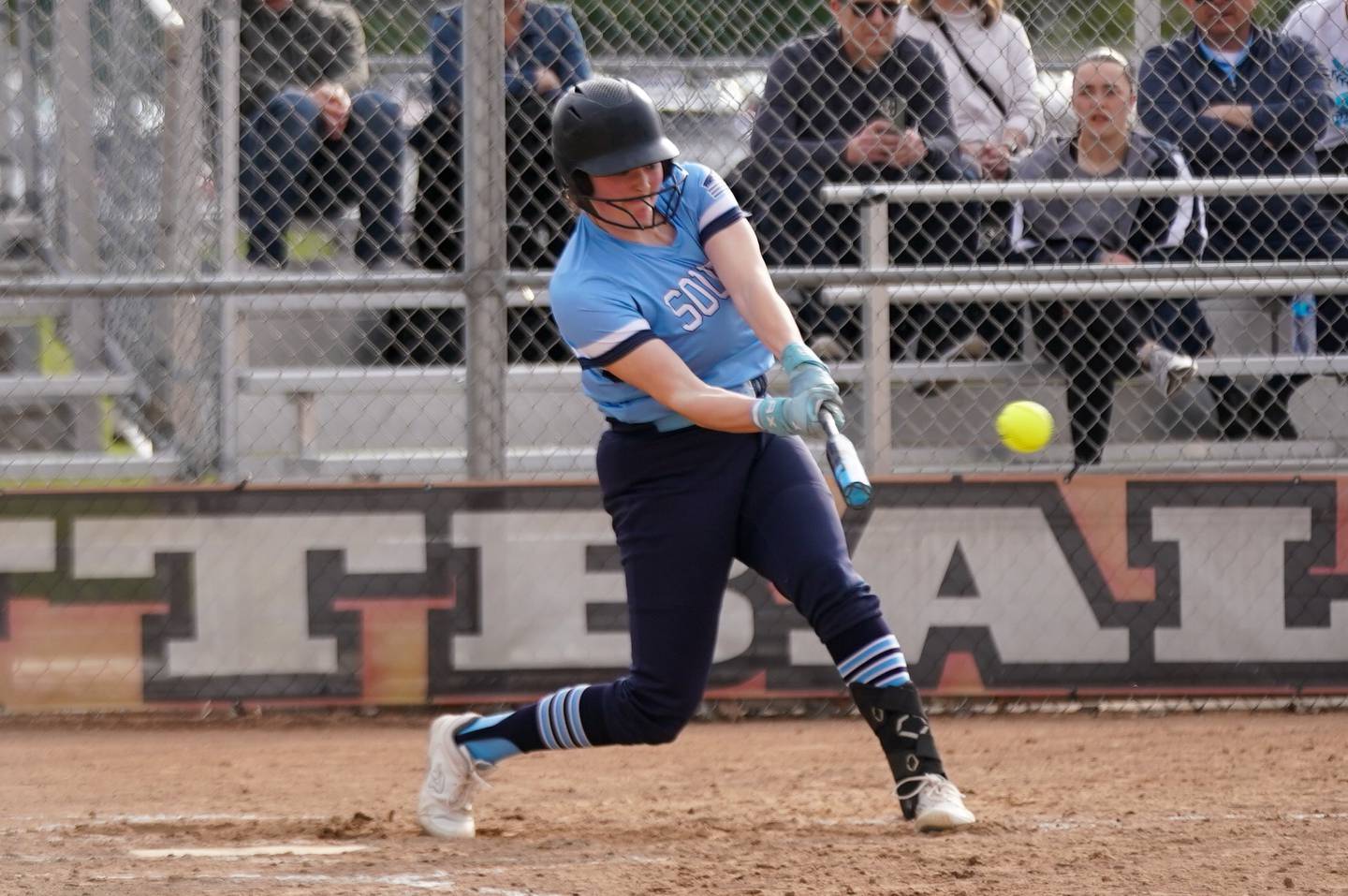 Downers Grove South's Ella Cushing (16) hits a two run homer against St. Charles East during a softball game at St. Charles East High School on Wednesday, April 10, 2024.