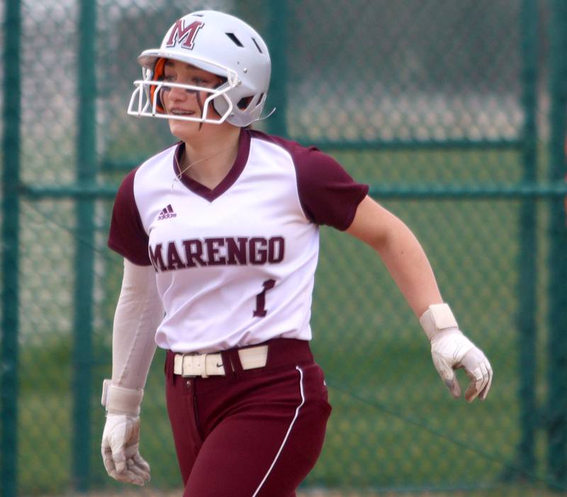 Marengo’s Gabby Christopher cruises home on a home run against Harvard in varsity softball at Marengo Thursday.