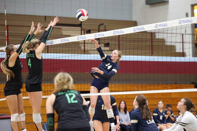 Lemont's Kaitlyn Wilson spikes the ball over Providence blockers during Providence's victory in two sets, 25-25, 25-18, over Lemont in the IHSA Class 3A Kankakee Sectional championship on Thursday, Nov. 6, 2025.