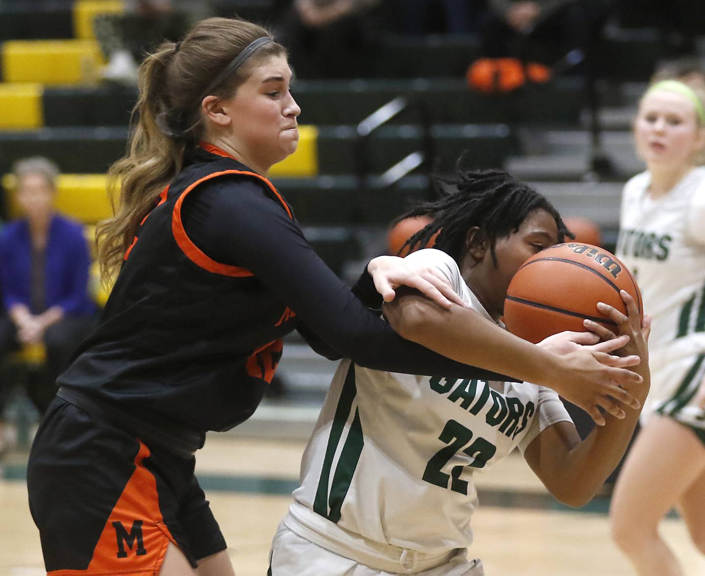 McHenry's Madalynn Friedle tries to knock the ball away from Crystal Lake South's Gabrielle Toussaint during a Fox Valley Conference girls basketball game Tuesday Jan. 10, 2023, at Crystal Lake South High School.