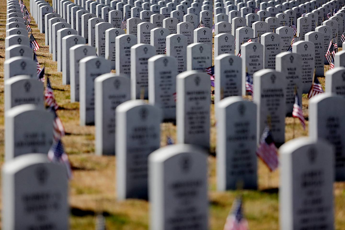 Flags are placed at each grave at Abraham Lincoln National Cemetery ahead of Monday's Memorial Day event in Elwood. Photographed Friday, May 23, 2014.