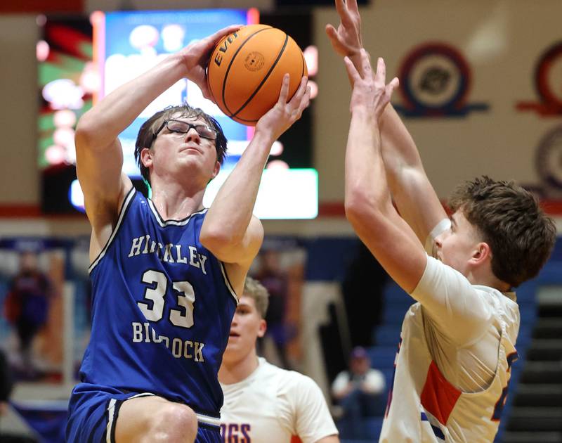 Hinckley-Big Rock's Marshall Ledbetter goes to the basket against Genoa-Kingston's Jaiden Lee Tuesday, Jan. 6, 2026, during their game at Genoa-Kingston High School.