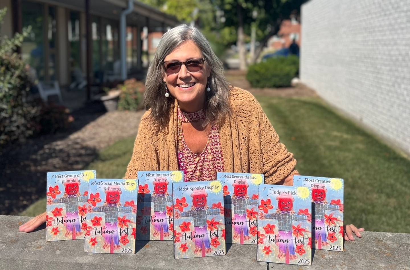 Patty Donahue from Image Awards, Engraving & Creative Keepsakes Inc., and local artist of Studio Patty D created trophies for the jack-o'-lantern contest during Autumn Fest Oct. 3 in downtown Geneva.