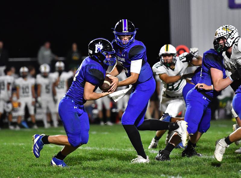 Peotone's Connor Pasch gets the handoff from Ruben Velasco  during a conference game against Coal City on Friday, Sep 27, 2024 at Peotone. (Dean Reid for Shaw Local News)