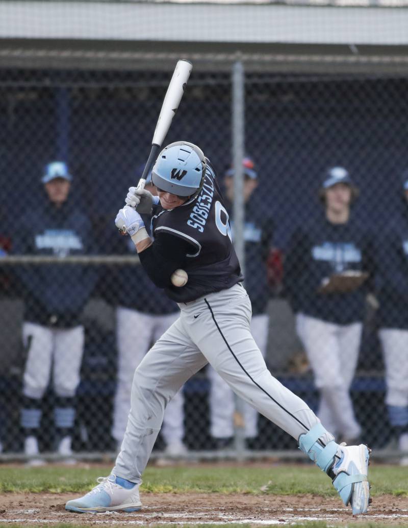 Willowbrook’s Isaac Sobieszczyk gets hit by a pitch against Downers Grove South during a game in Downers Grove on Tuesday, April 5, 2022.