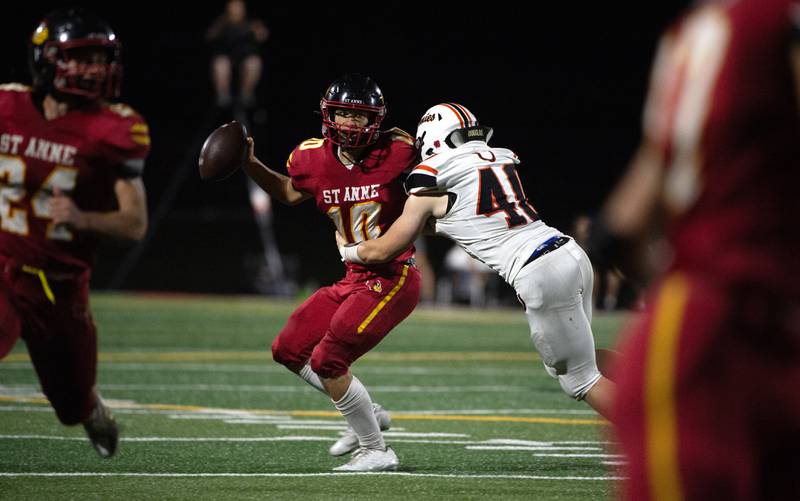 St.Anne's Grant Pomaranski looks for an open man as South Fork's Carter Foli attempts to bring him down in a game on Friday, Septmeber 26, 2025.
