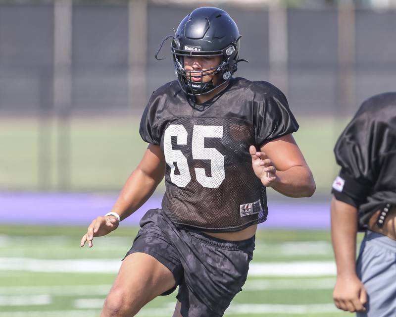 Aiden Solecki works with the defense at Downers Grove North High School football practice, Thursday, Aug 14, 2025  in Downers Grove.