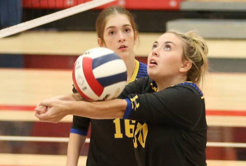 Somonauk's Addie Britt returns a serve from Earlville as teammate Aubrey Chiavario watches on Tuesday, Aug. 29, 2023 at Earlville High School.