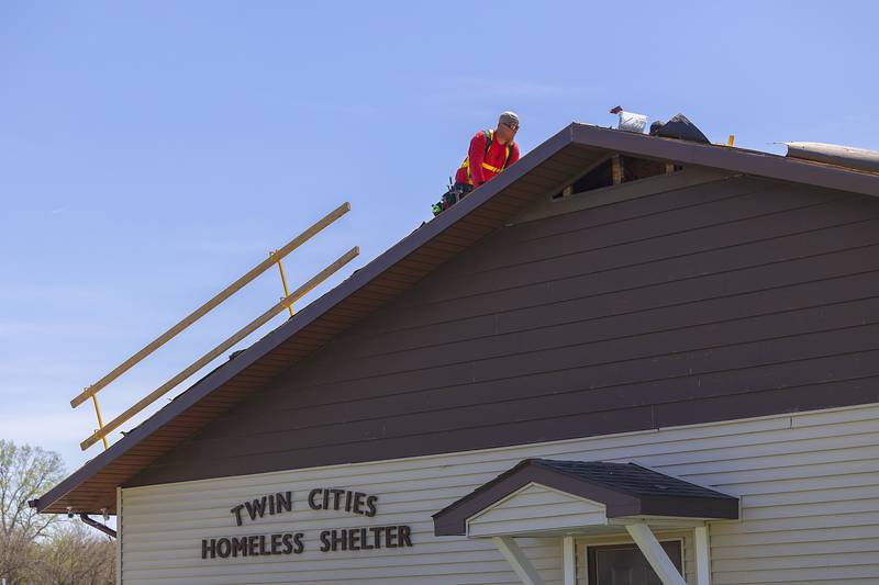 TCS, Total Construction Services of Sterling, work on the roof of the Twin Cities Homeless Shelter on Friday, April 19, 2024 in Sterling.