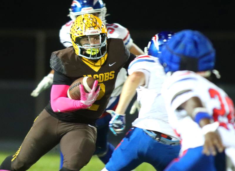 Jacobs’ Caden DuMelle navigates traffic against Dundee-Crown in varsity football  at Jacobs High School in Algonquin on Friday, Oct. 10, 2025.