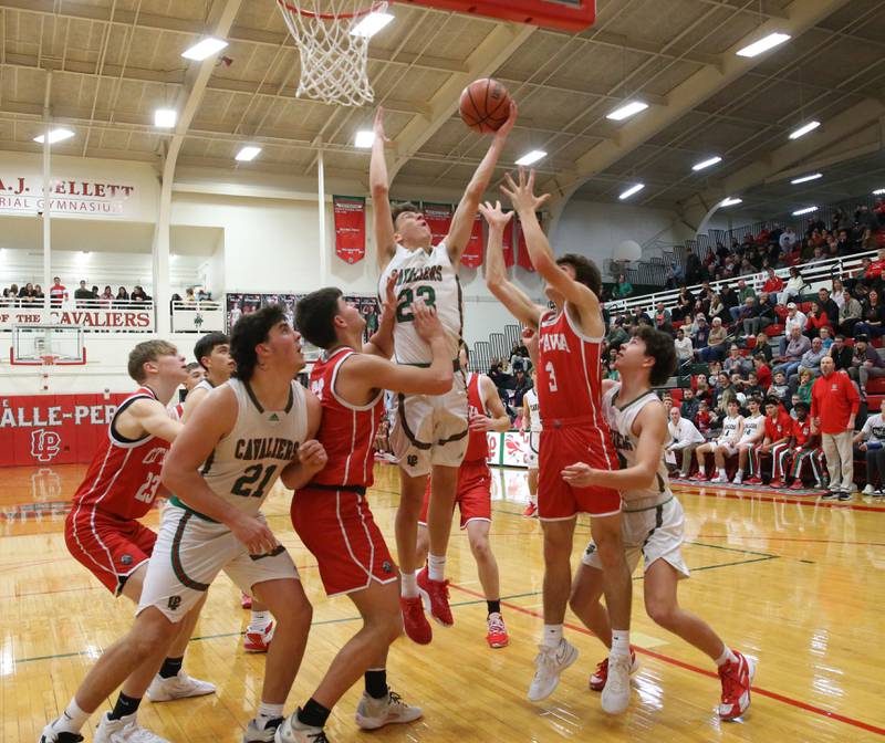 L-P's Nicholas Olivero grabs a rebound in the lane over Ottawa's Drake Kaufman on Friday, Jan. 5, 2024 at Sellett Gymnasium.