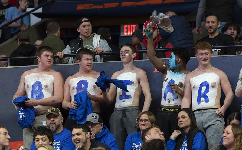 Newman fans cheer on Briar Ivey as he takes on Riverdale’s Blake Smith in the 157 pound weight class of the 1A state individual wrestling finals Saturday, Feb. 22, 2025, at State Farm Center in Champaign.