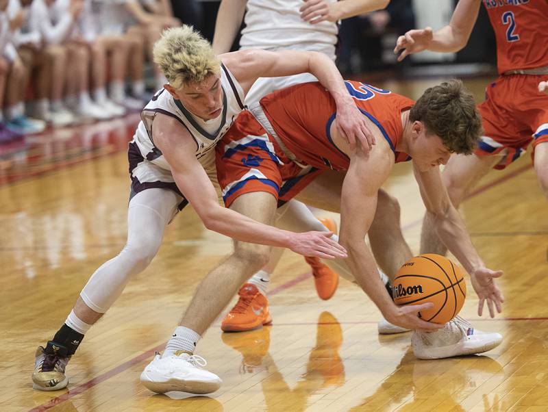 Eastland’s Braden Anderson and Dakota’s Liam Burke fight for a loose ball Wednesday, March 4, 2026, in the Orion 1A sectional semifinal.