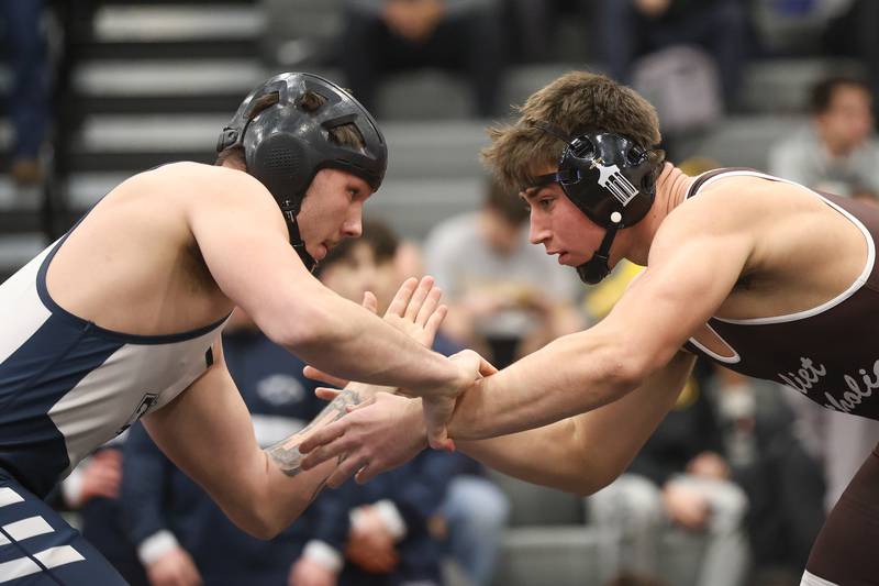 Plainfield South’s Ryker Czubak faces off with Joliet Catholic’s Mason Bucon in the Class 3A Minooka Regional 215 pound championship on Saturday, Jan. 31, 2026 in Minooka.