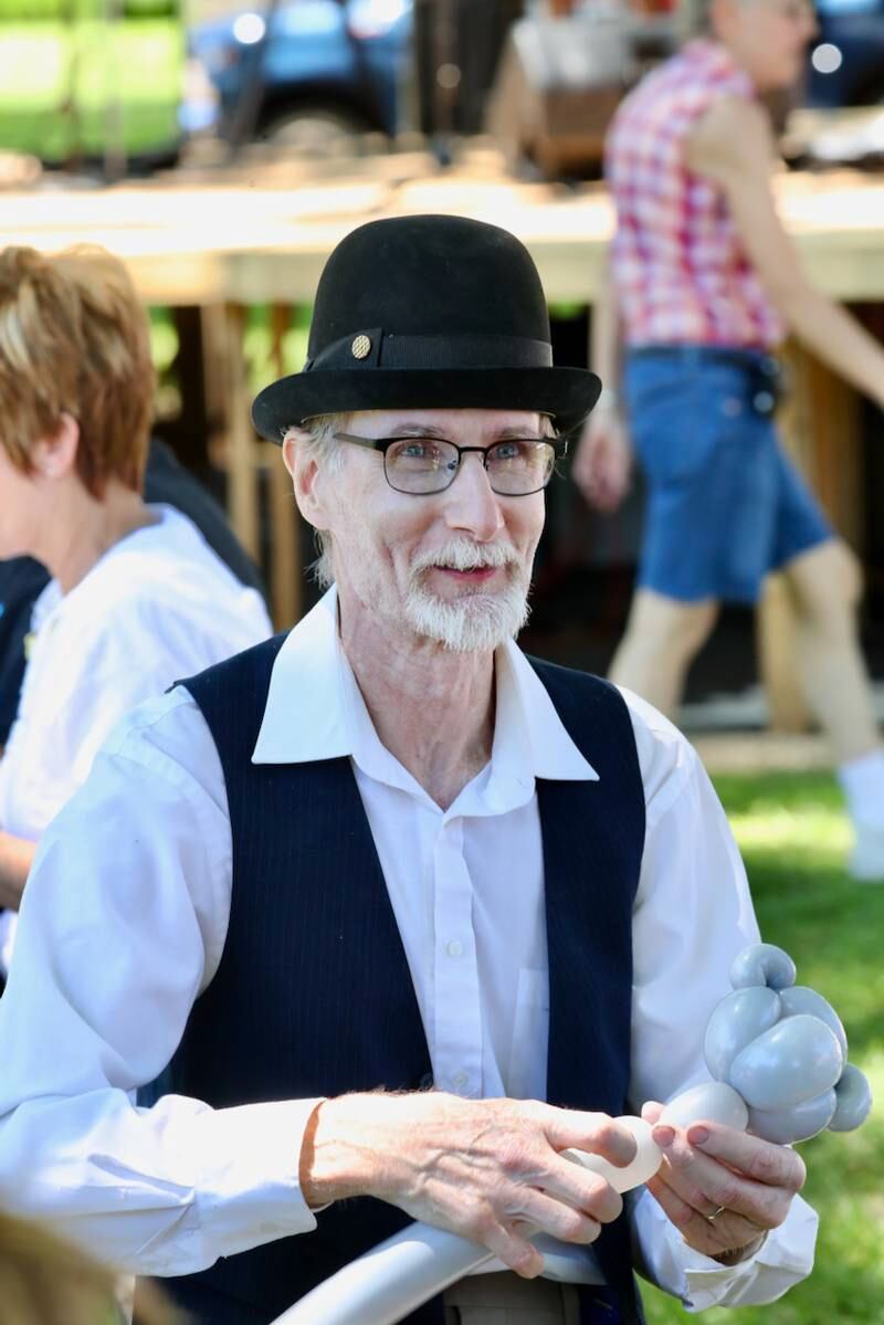 Mr. Cinnamon the Clown makes balloon figures during the Beef and Ag Days Celebration in Princeton.
