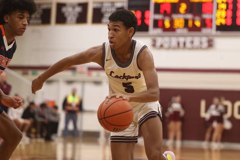 Lockport’s Quinton Hunter makes a move to the basket against Oswego.