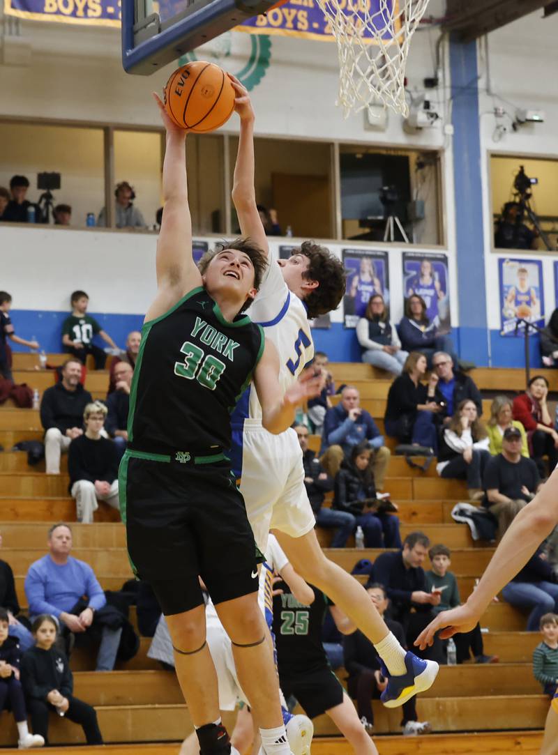 York's Will O'Leary (30) shot is blocked by Lyons' Owen Carroll (5) during a varsity basketball game between York Community and Lyons Township high schools on Friday, Jan. 9, 2026 in La Grange.