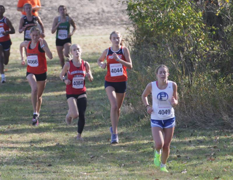 Princeton's Kiana Brokaw leads a pack of runners in the Class 1A Regional Cross Country gils race on Saturday, Oct. 22, 2022 at the Seneca FFA Farm in Marseilles.