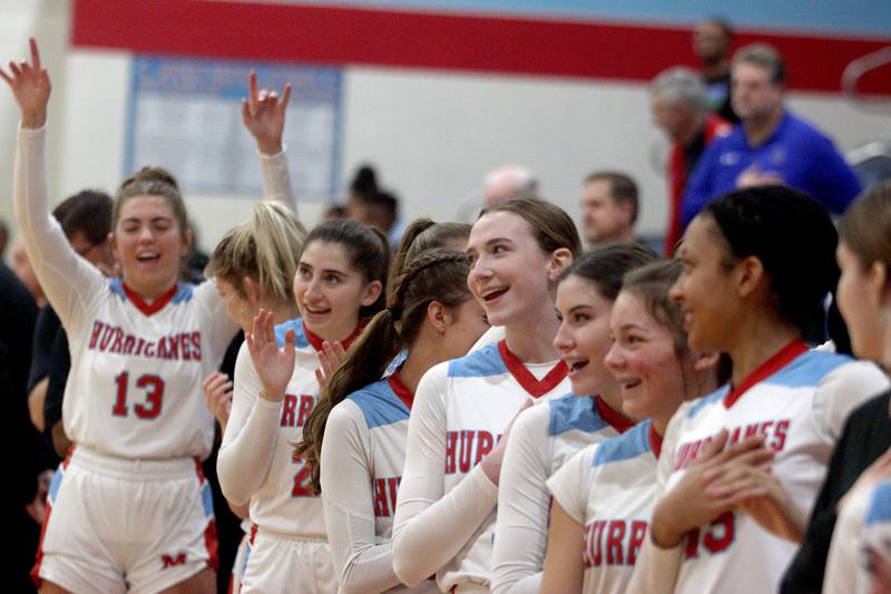 Marian Central’s Hurricanes get revved up before facing  Rockford Guilford in varsity girls basketball Saturday at Landers Pavilion on the campus of Marian Central High School in Woodstock.