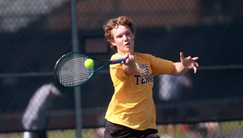 Jacobs’ Augie Nelson returns the ball during a doubles match with partner Soham Kalra (not pictured) in the state championship preliminaries at Buffalo Grove High School on Thursday, May 23, 2024.