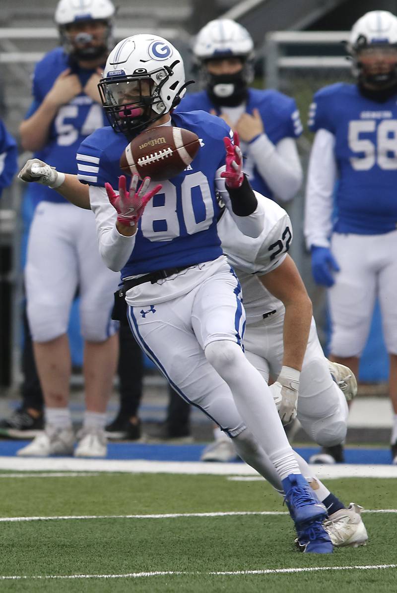 Geneva’s Bennett Konkey catches the ball in front of Cary-Grove's Michael Dunkin during an IHSA Class 6A semifinal football game on Saturday, Nov. 23, 2024, at Geneva High School.