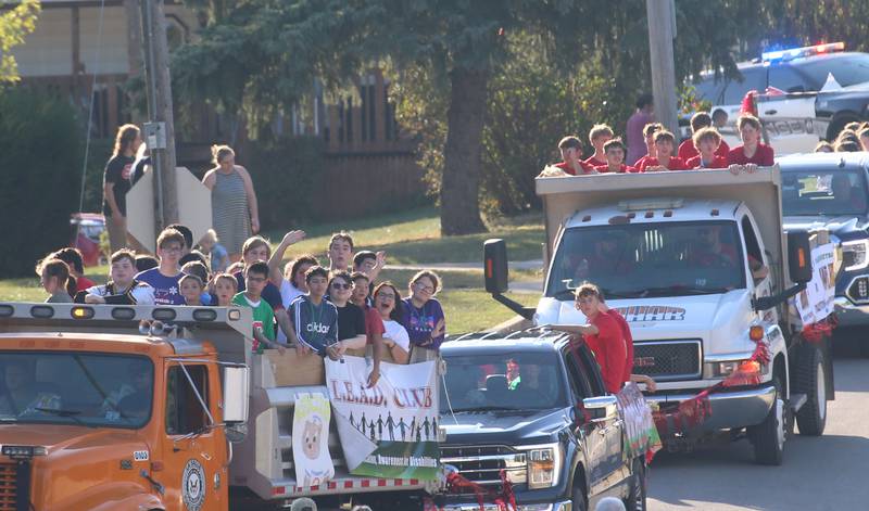 L-P L.E.A.D. club and the basketball team ride in floats during the L-P Homecoming parade on Thursday, Sept. 26, 2024 near the corner of 7th Street and Orleans Street in Peru.