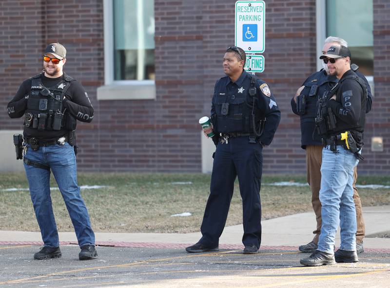 A small group of DeKalb Police officers came out to watch as Northern Illinois University students gathered Friday, Feb 13, 2026, in front of the DeKalb Police Department, to protest against recent nationwide U.S. Immigration and Customs Enforcement activity.