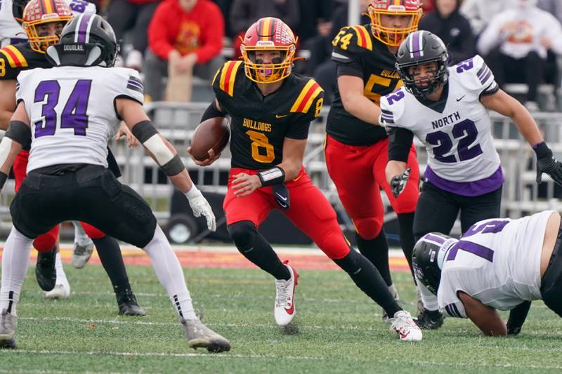 Batavia's Michael Vander Luitgaren (8) carries the ball on a keeper against Downers Grove North during a class 7A quarterfinal playoff football game at Batavia High School on Saturday, Nov. 16, 2024.