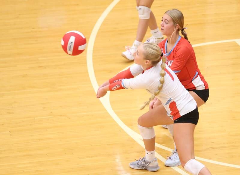 Ottawa's Ella Damron and libero Kendall Biba return a serve from L-P on Thursday, Oct. 17, 2024 in Kingman Gym at Ottawa High School.