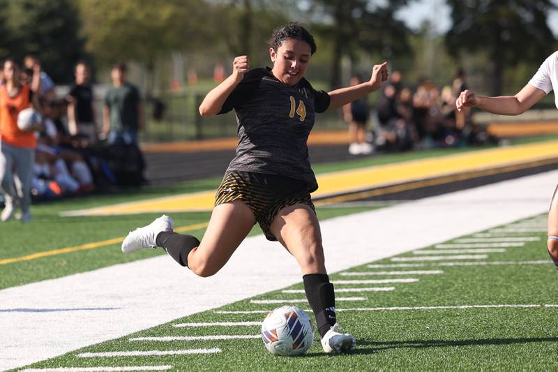 Joliet West’s Marlene Tinoco sends the cross pass against Joliet Central on Tuesday, April 30, 2024.