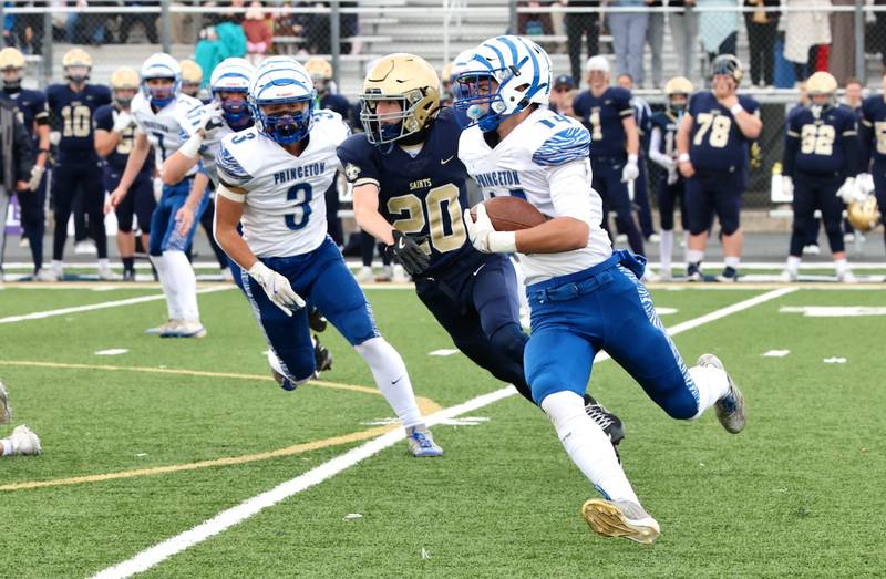 Princeton's Jack Oester carries the ball against Bloomington Central Catholic in Saturday's 3A playoff opener in Bloomington.