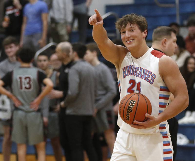 Marian Central’s Christian Bentancur points to the student body after scoring his 2,000 point during a nononference boys basketball game against Marengo on Tuesday, Feb.13, 2024, at Marian Central High School.