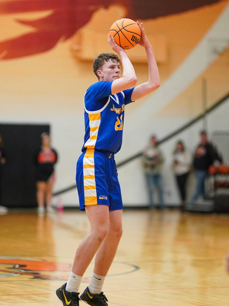 Johnsburg's Joshua Kaunas (20) shoots a three pointer against Sandwich during a basketball game at Sandwich High School on Friday, January 31, 2025.