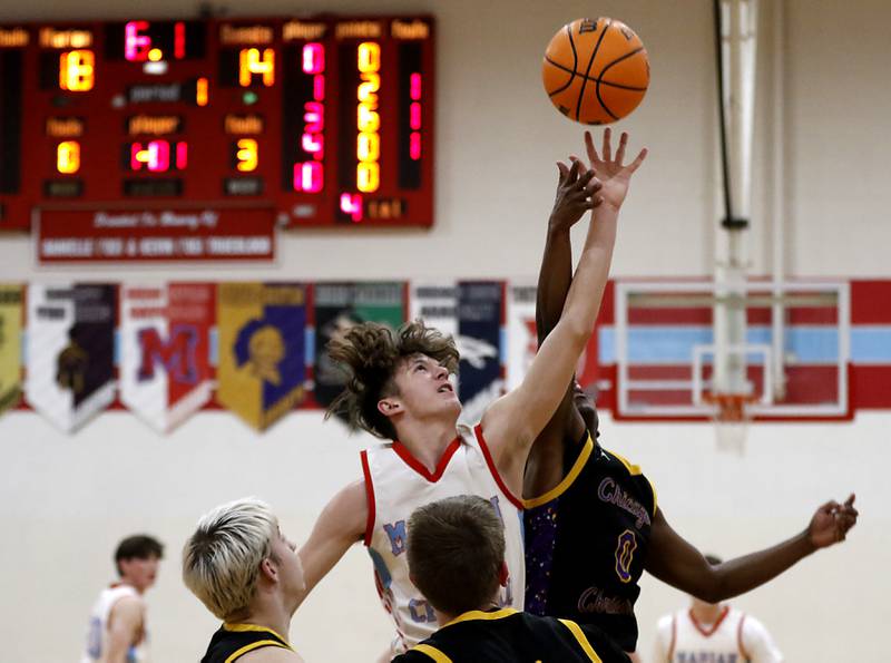 Marian Central's Derek Leitzen battles with Chicago Christian's Kerry Teague for a rebound during a Chicagoland Christian Conference basketball game on Tuesday, Jan. 21, 2025, at Marian Central High School.