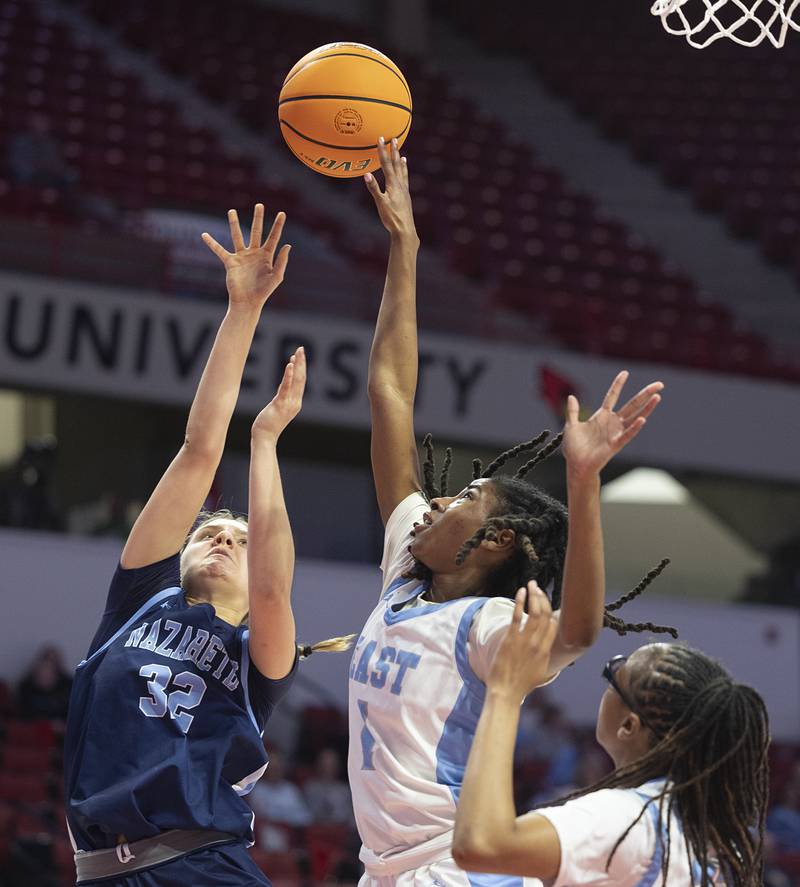 Nazareth’s Stella Sakalas has a shot blocked by Belleville East’s Denaya Bartelheim Friday, March 6, 2026, in the Class 4A girls state semifinal game at CEFCU Arena at ISU.