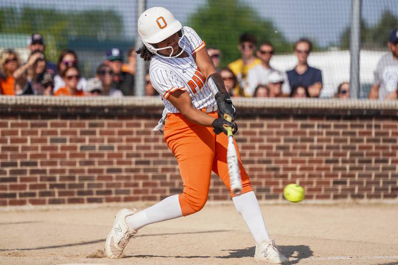 Oswego’s Jaelynn Anthony (20) singles against Wheaton North during a Class 4A Oswego Sectional Final game at Oswego High School on Friday, June 6, 2025.
