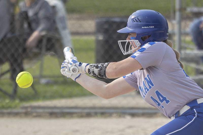 Newman’s Molly Olson puts down a bunt against Putnam County Thursday, May 18, 2023.