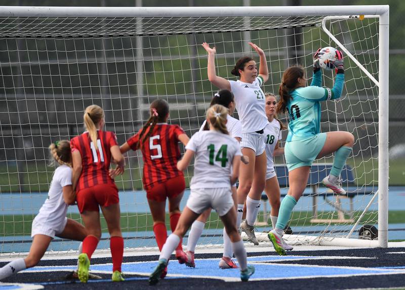 York goalkeeper Ava Lewandowski (right) makes a save of the final Hinsdale Central shot of the match during the Class 3A Downers Grove South Sectional final game on May 30, 2025 at Downers Grove South High School in Downers Grove .