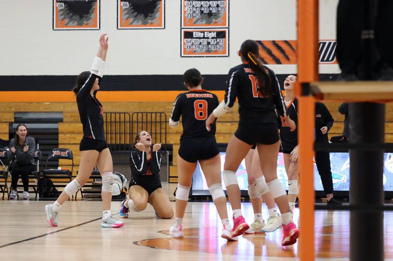 Beecher players celebrate earning the game point during the Bobcats' victory in two sets, 25-22, 25-23, over Grant Park in the RVC championship game on Monday, Oct. 20, 2025, at Beecher High School.