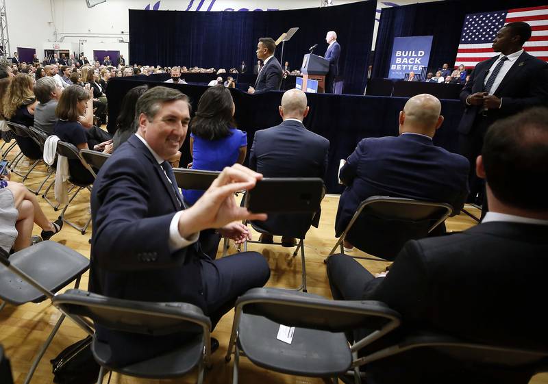 An unidentified man takes a selfie as President Joe Biden speaks Wednesday, July 7, 2021, at McHenry County College in Crystal Lake.