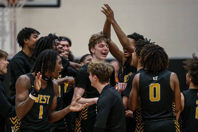 Joliet West celebrates after defeating Rich Township in the Class 4A boys regional game. Feb 23, 2024.