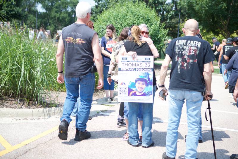 Bikers and families embrace at the 9th Annual Ride for John for my child's life matters on Saturday Aug.2, 2025 in Carol Stream.